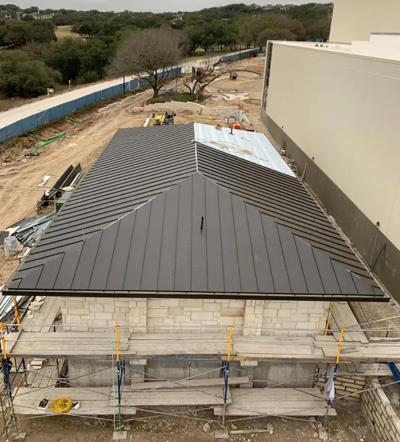 Metal roof new construction with scaffolding in Norton
